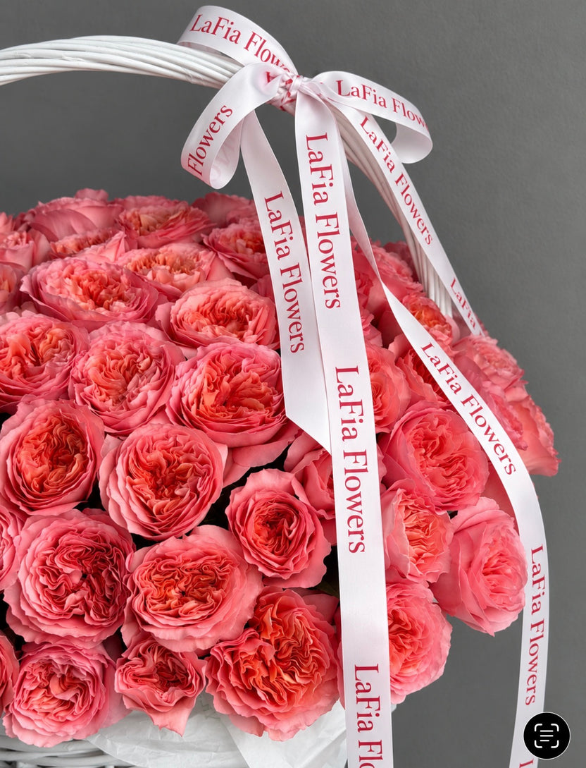 Close-up of Blush Royale pink roses and LaFia Flowers ribbon