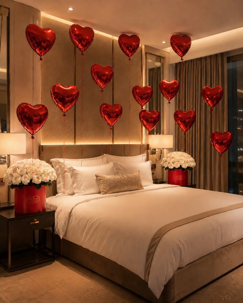Floral room decoration with red heart balloons and white rose boxes - LaFia Flowers