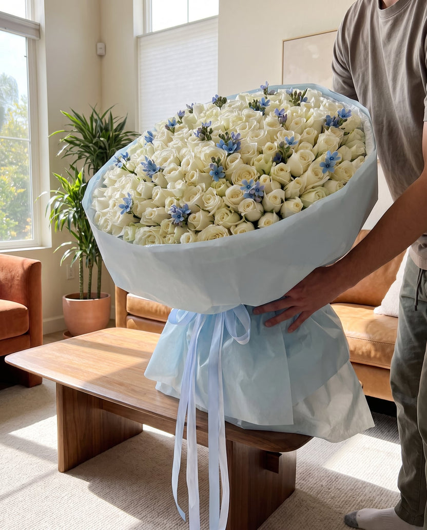 White and blue 151-rose bouquet held indoors to show its scale - LaFia Flowers