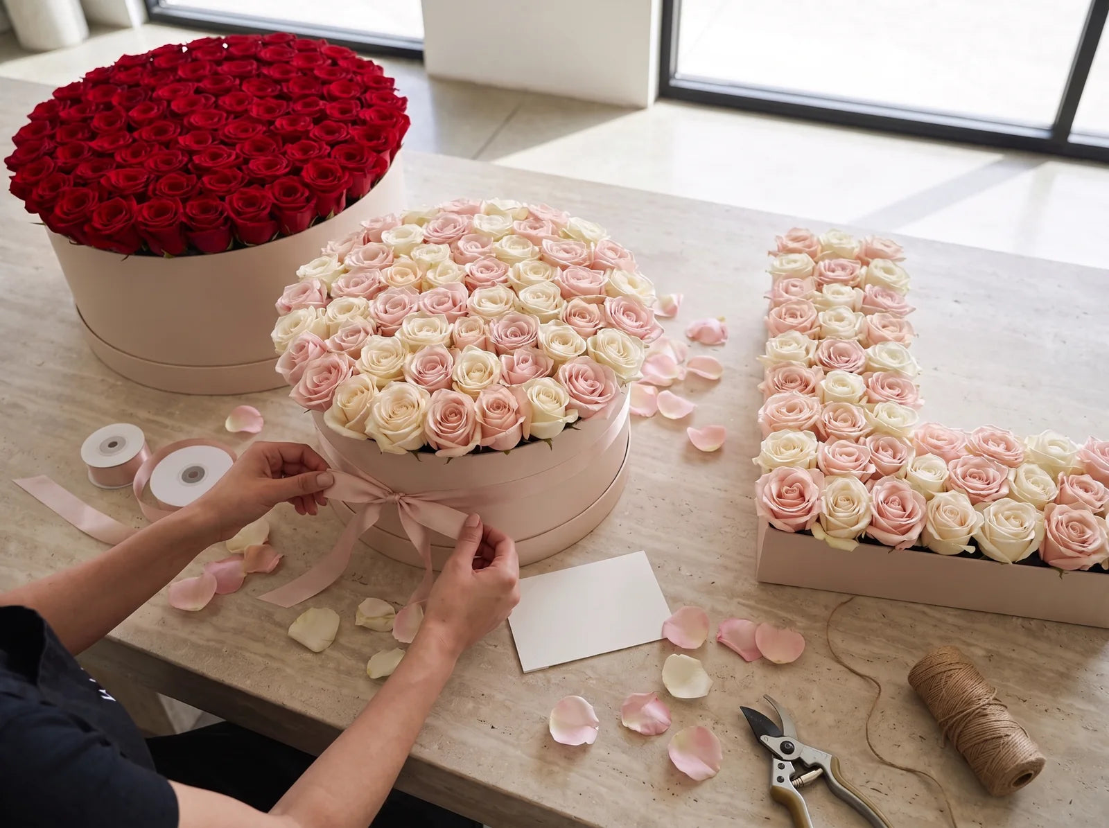 Concept for preparing several premium rose arrangements for corporate recipients